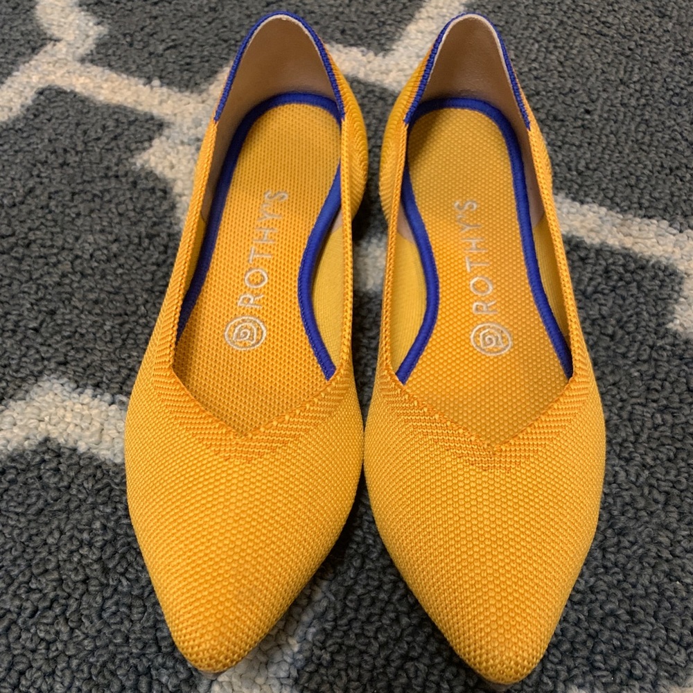 Mustard colored with blue accents Rothy’s size 8.